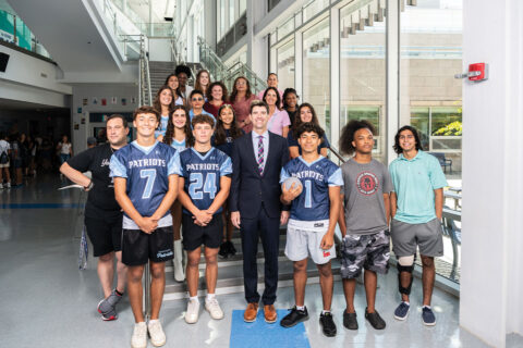 Principal Kevin Clark with students and staff