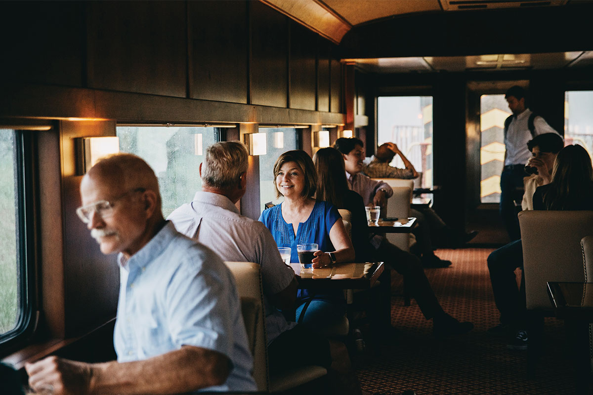 Passengers dining inside train