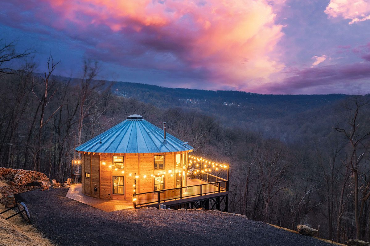 Yurt on mountainside at dusk