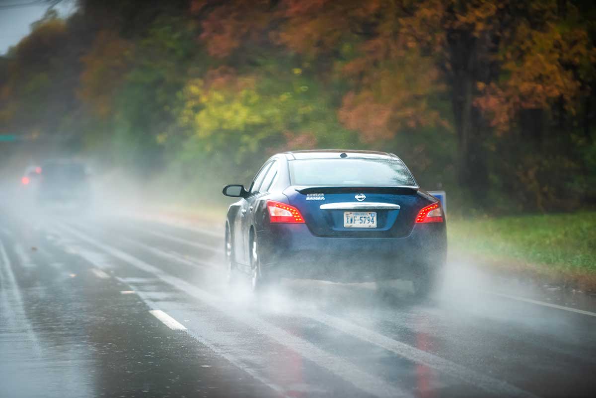 car on highway in fall