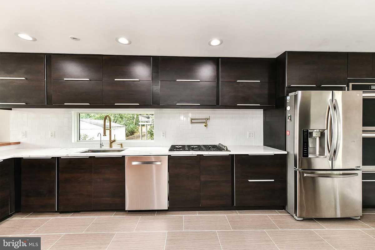 kitchen with dark brown cabinets and stainless steel appliances