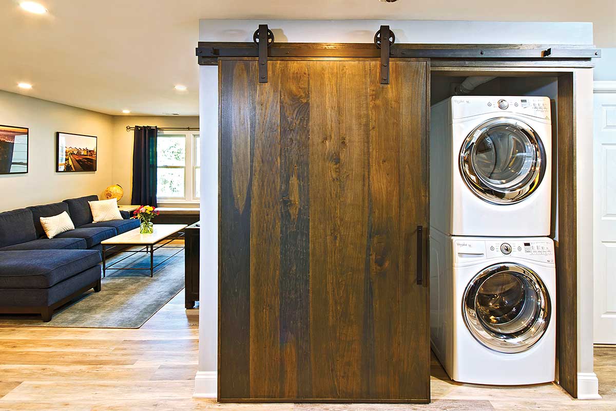 laundry room with sliding wood door