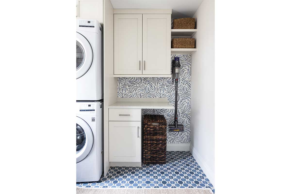 laundry room with white shelves