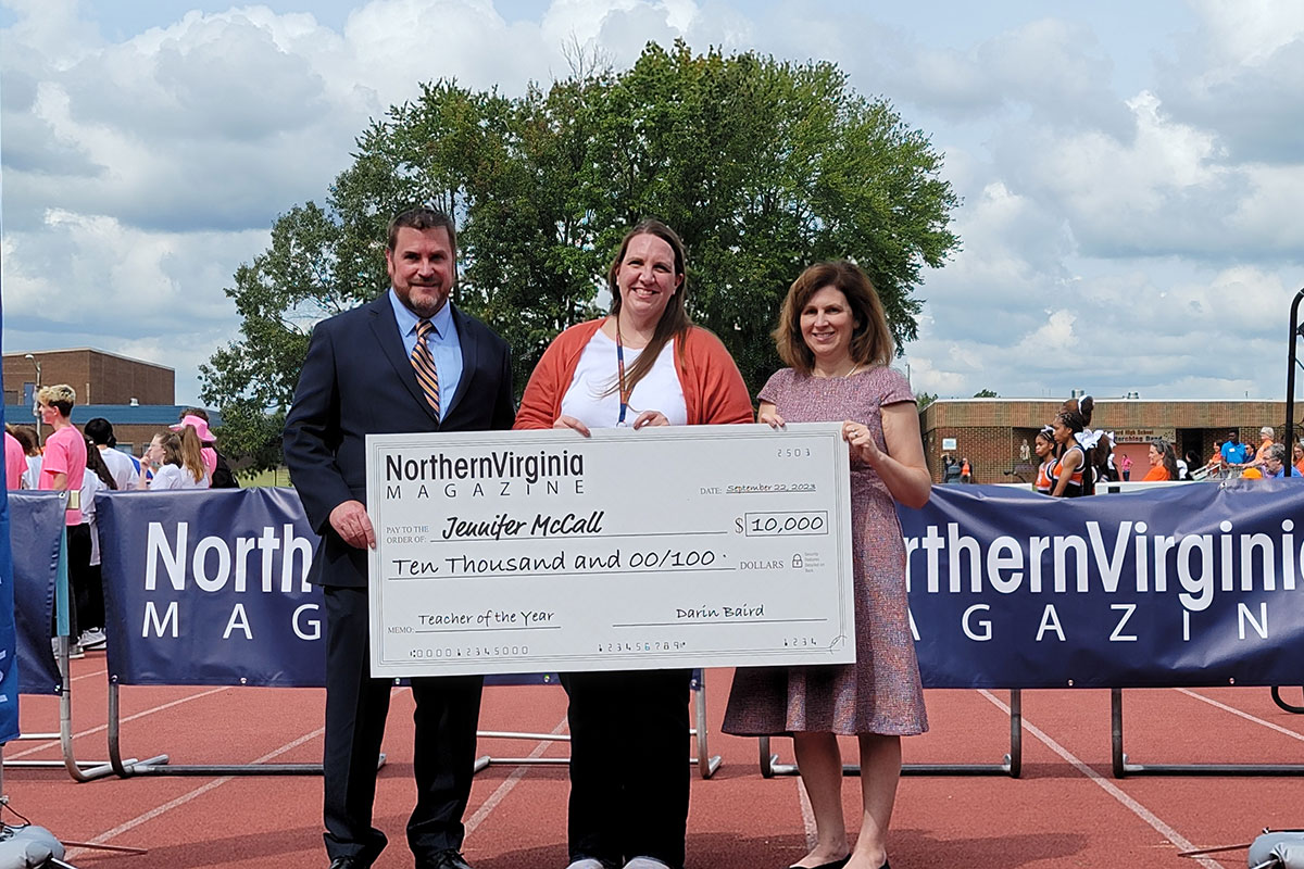 Darin Baird, Jennifer McCalland Amy Ayres with check