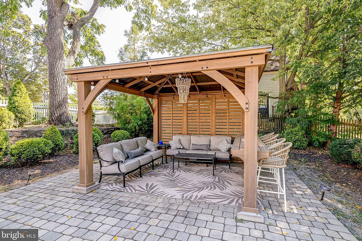 Gazebo on paved area in back yard
