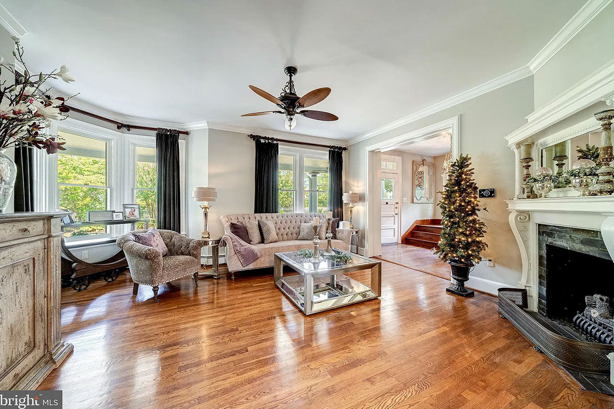 Living room with bay windows and fireplace