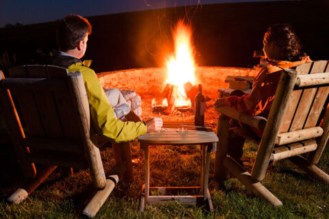 Couple sitting at fire pit