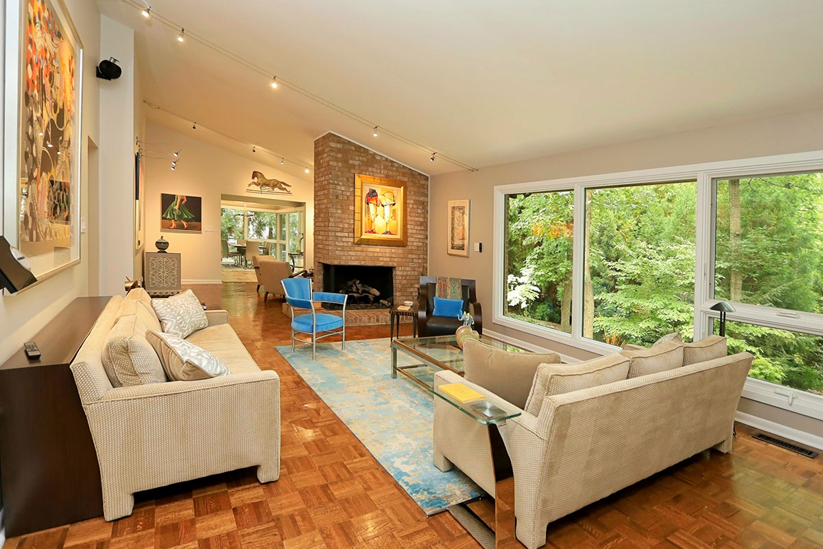 Interior of home with large window and slanted ceiling