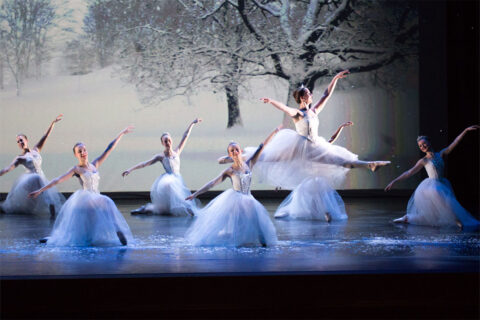 Ballerinas dressed in white in The Nutcracker
