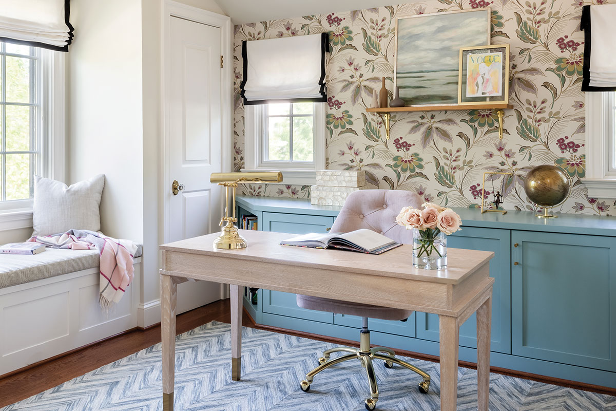 Home office with blue counter, bright botanical wallpaper