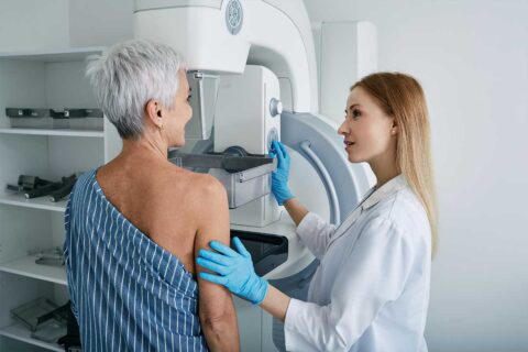 woman getting mammogram