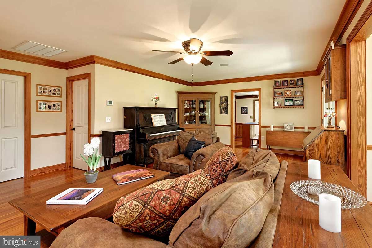 living room with wood floors and trim