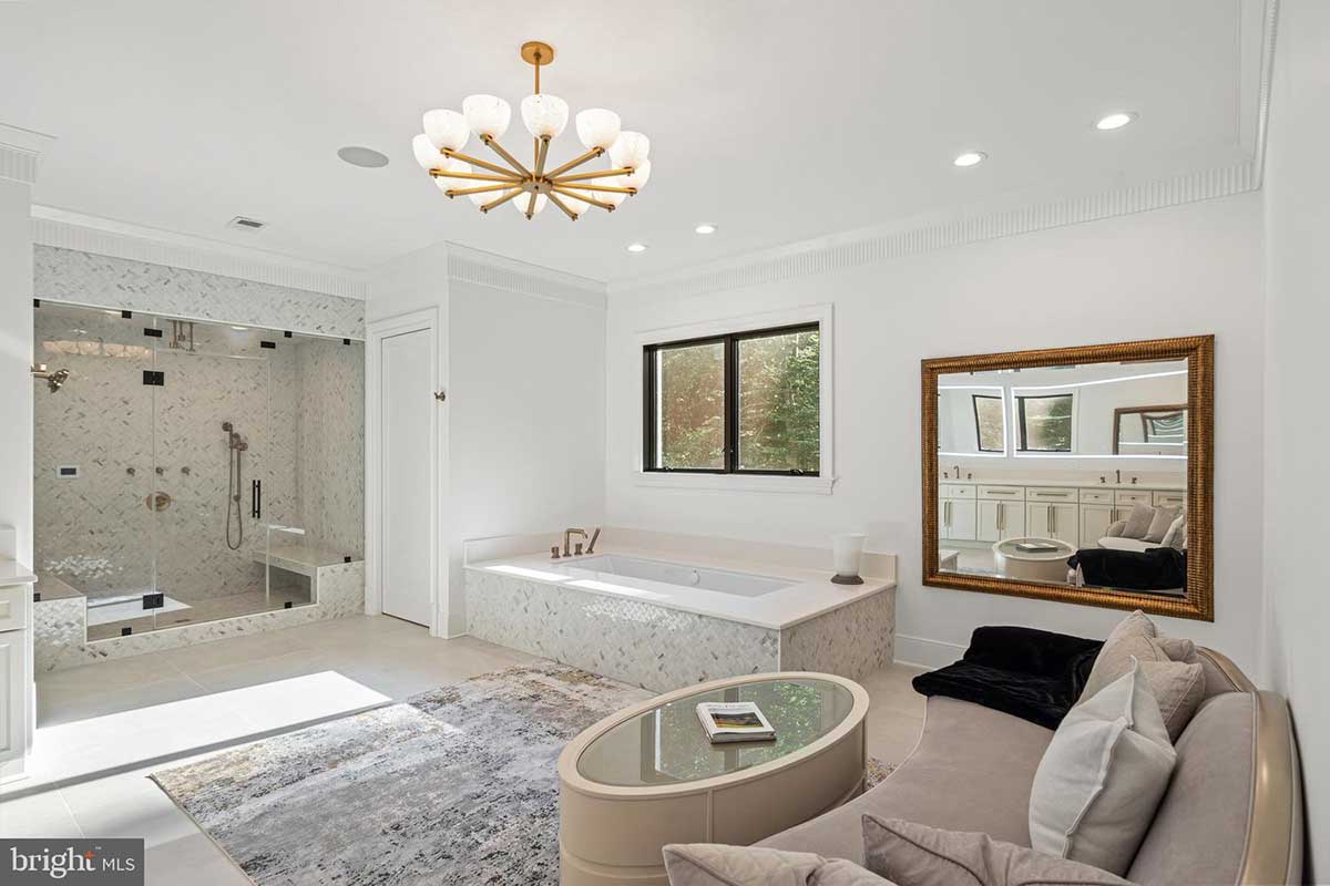 bathroom with steam shower and jet tub