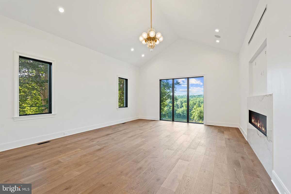 bedroom with vaulted ceilings and fireplace