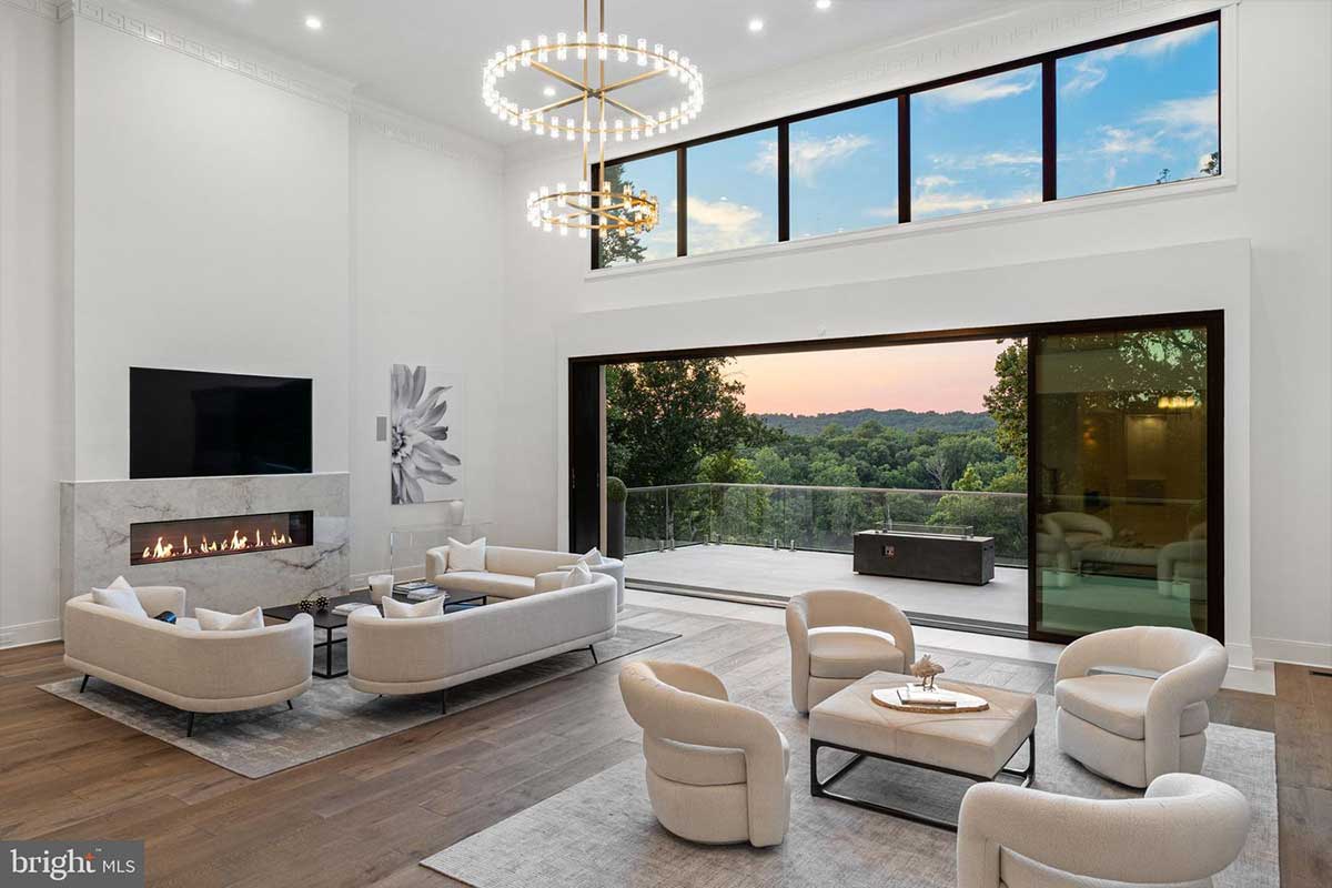 great room with wall of glass windows and doors