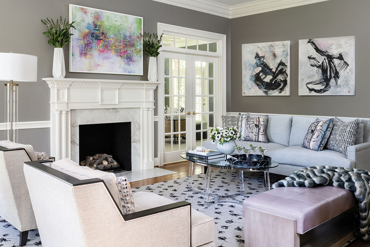Living room with white mantel and abstract art
