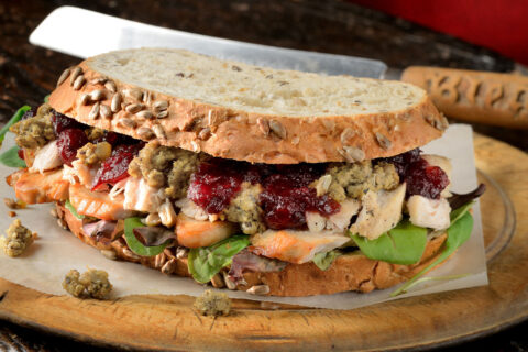 Sandwich with turkey, cranberry sauce, and stuffing