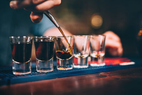 drinks being poured at a bar