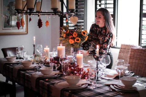 holiday host setting table for thanksgiving