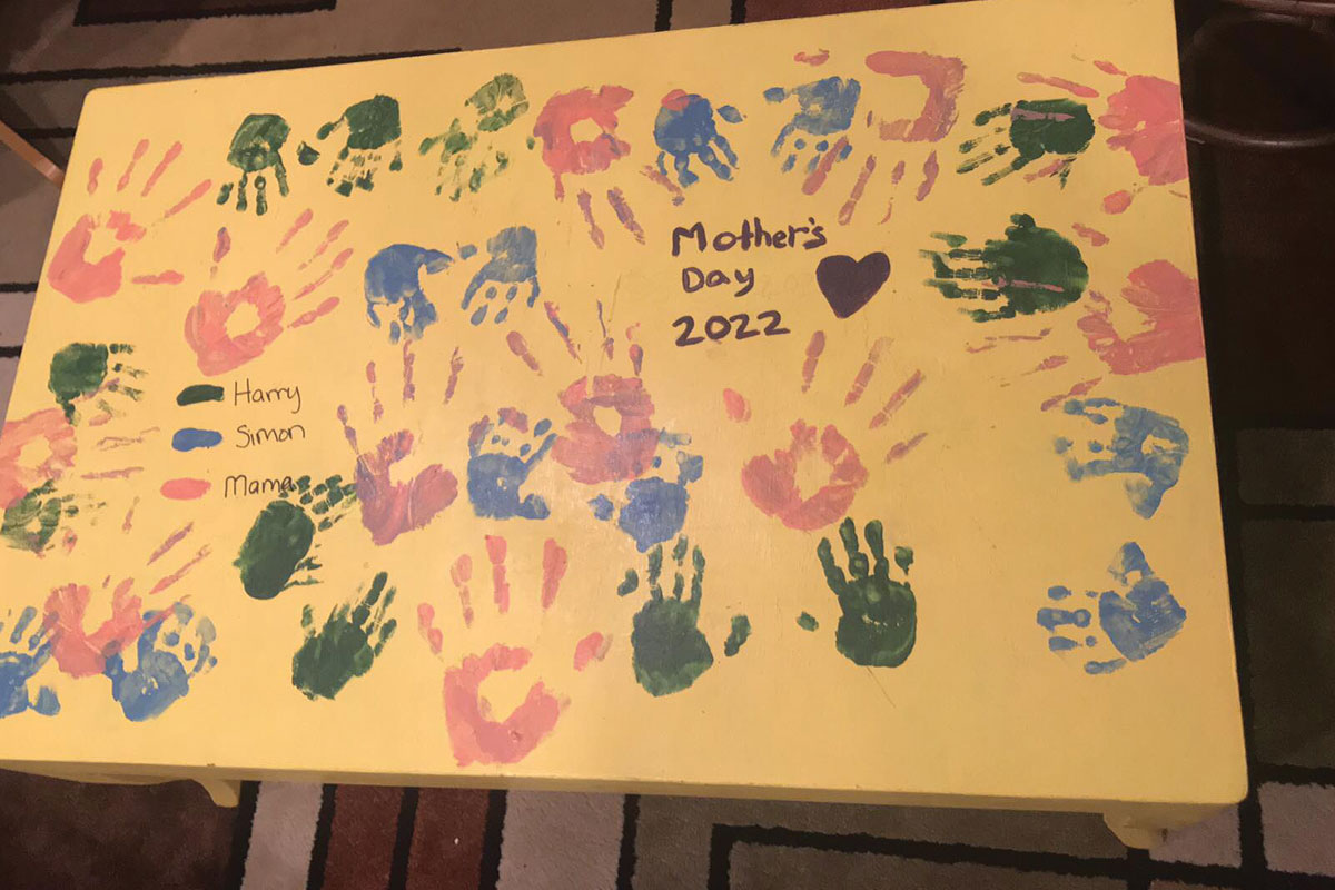 Yellow coffee table with handprints 