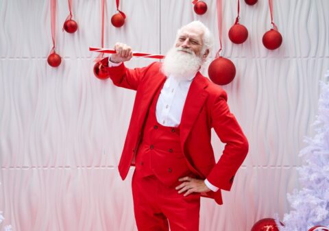 Fashion Santa poses.