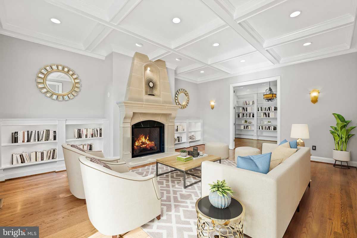 family room with try ceiling and wood burning fireplace