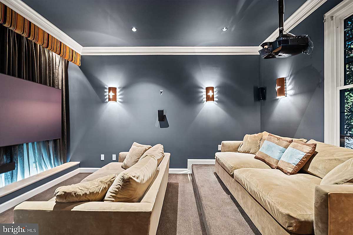 home theater with tan couches