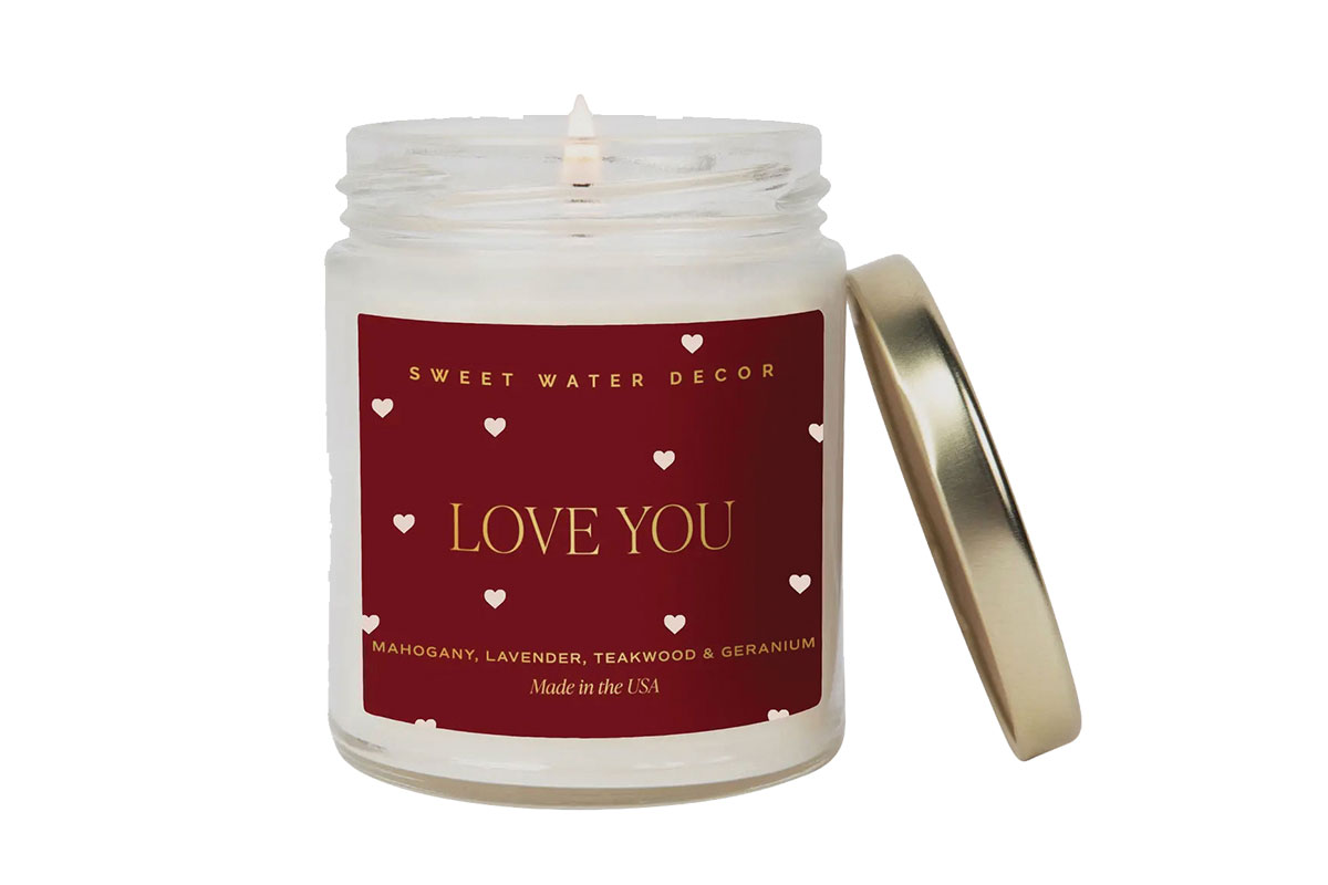 Candle with red label that says "Love You"