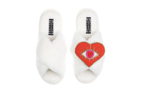 White slippers with heart eye detail