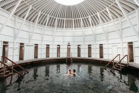 couple in renovated hot springs