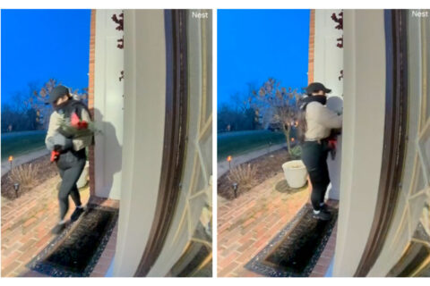 Woman in burglary ring approaches home with roses.