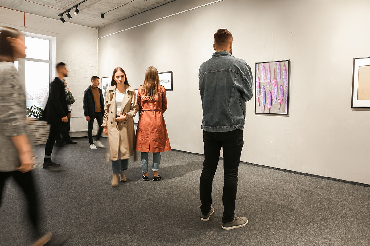People looking in art gallery