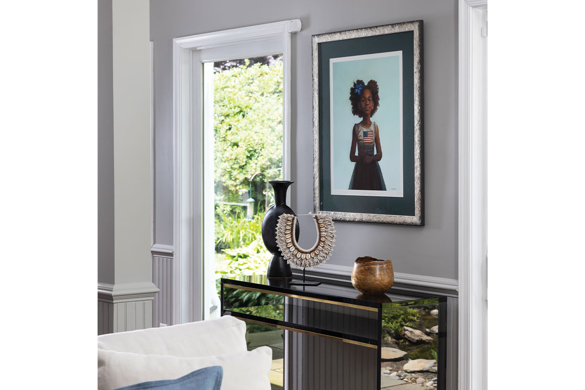 A painting of a girl hangs in the living area