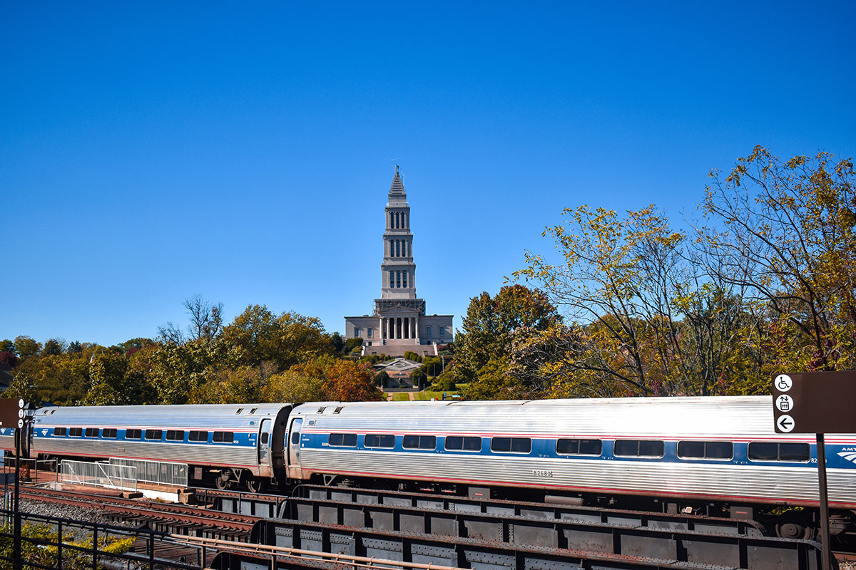 Amtrak train passing Masonic Temple in Alexandria