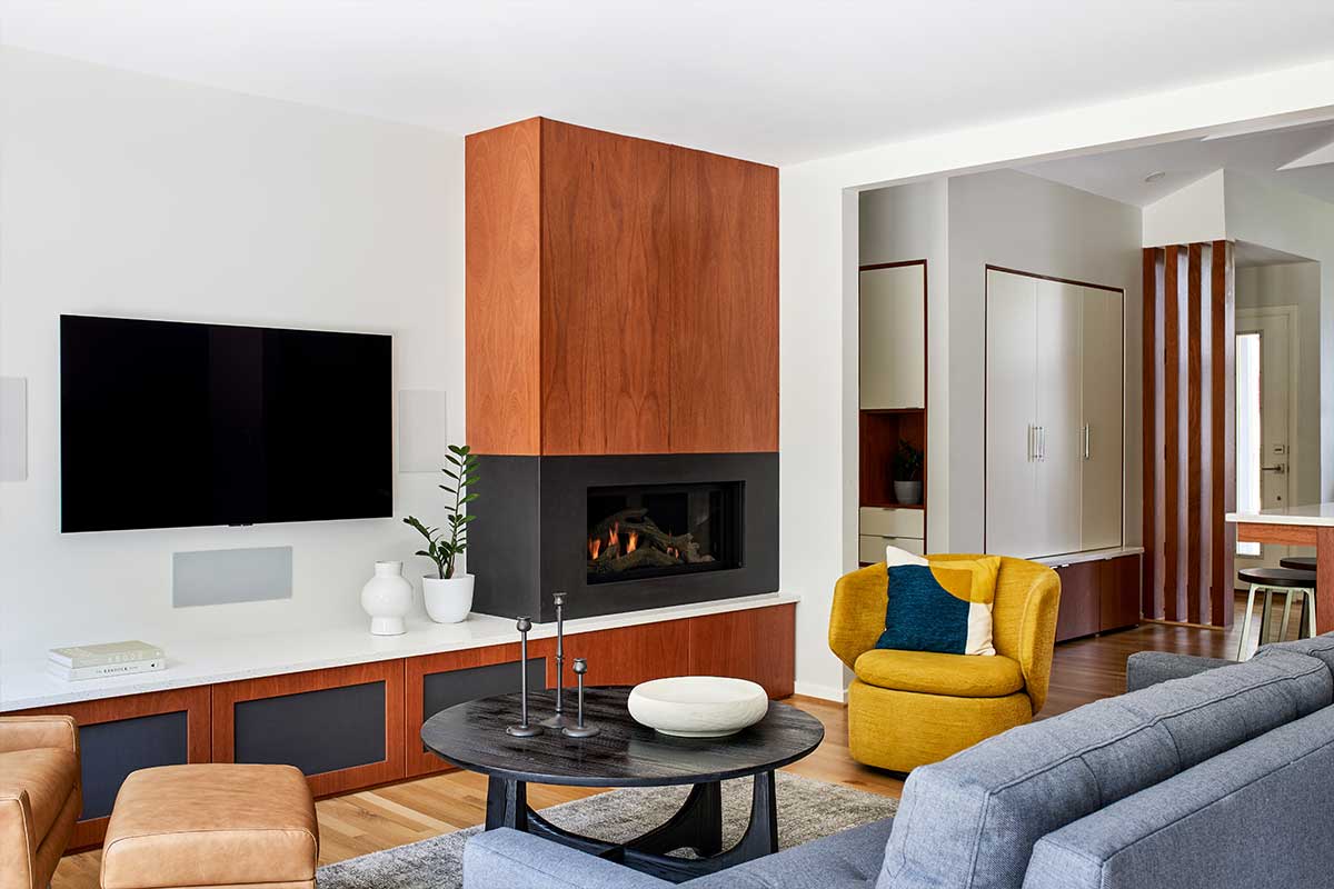 living room with modern fireplace and wood accents