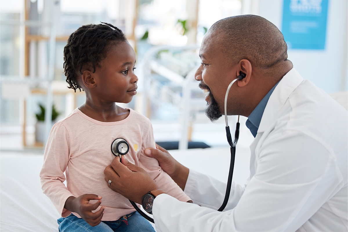doctor checking child's heart with stethoscope