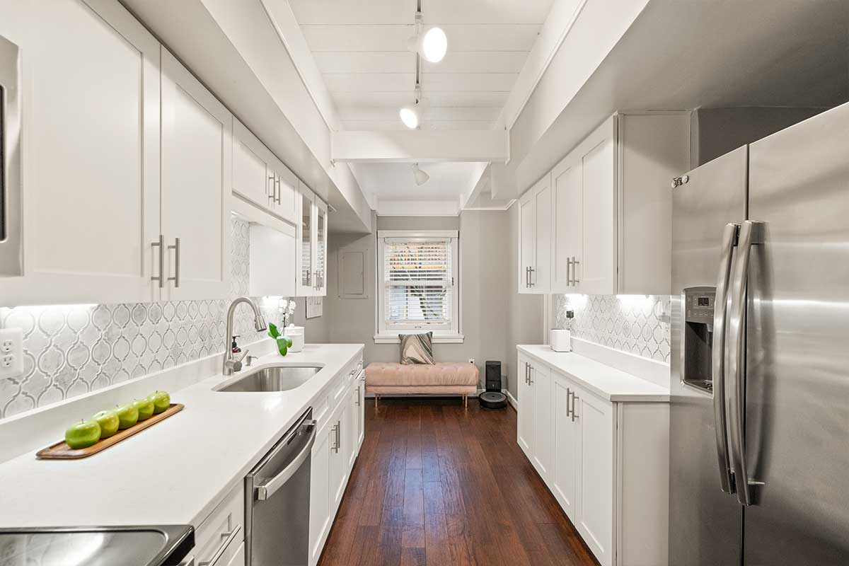 white kitchen cabinets and white quartz countertops