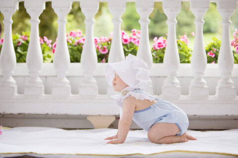 Baby wearing clothing by The Beaufort Bonnet Company