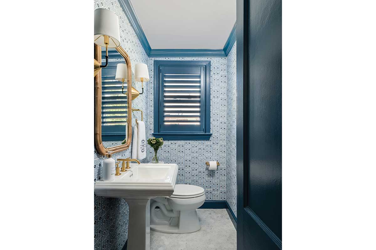 bathroom with blue patterned wallpaper