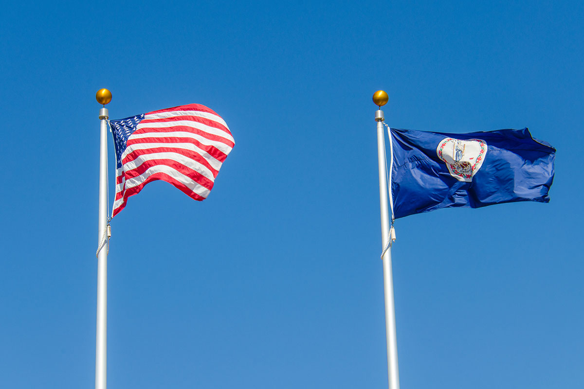 U.S. flag and Virginia flag in the wind
