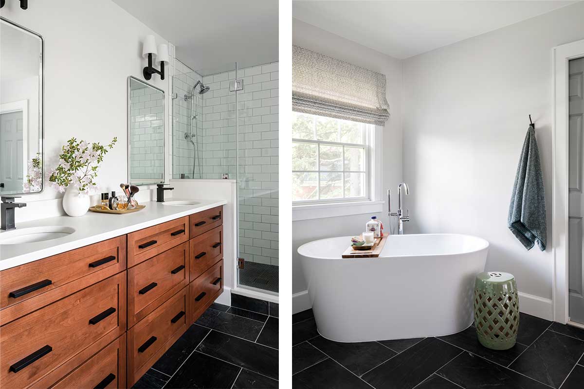 midcentury bathroom vanity with dark tile floor and soaking tub
