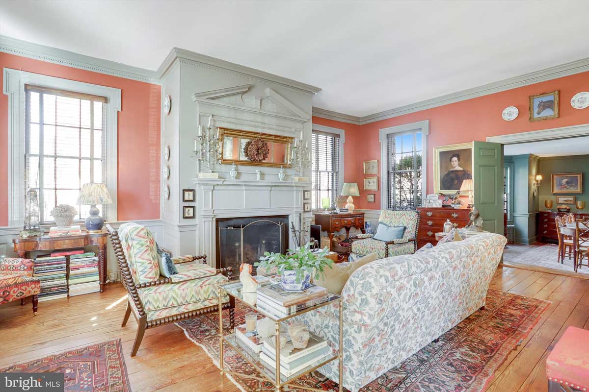 peach colored front parlor with fireplace