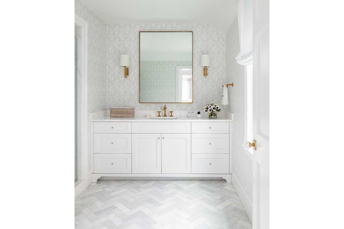 white bathroom with herringbone flooring 