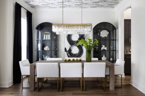 white dining room with wallpapered ceiling