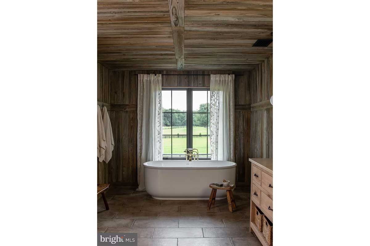 bathroom with wood planks and freestanding tub