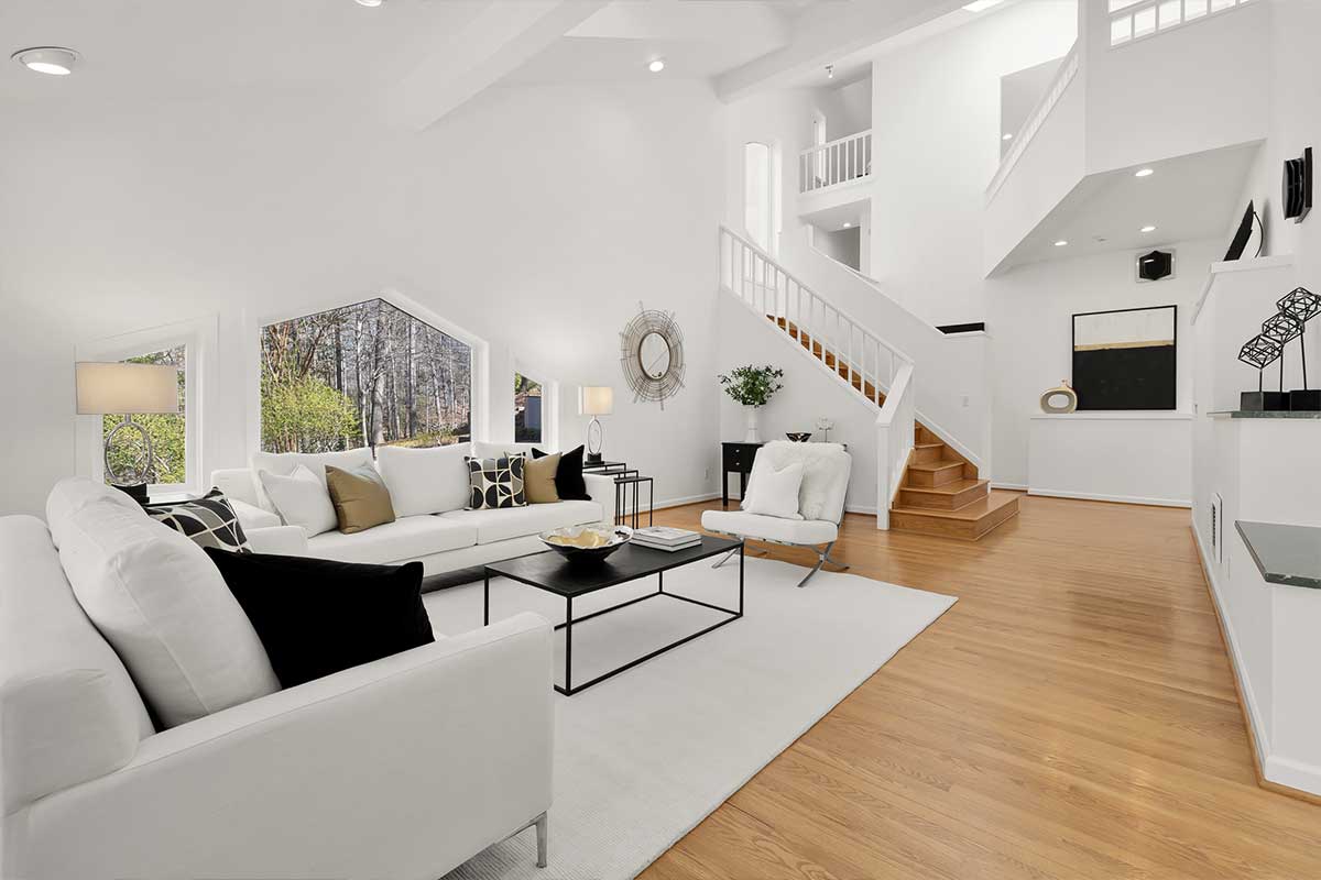 white living room with light colored flooring 