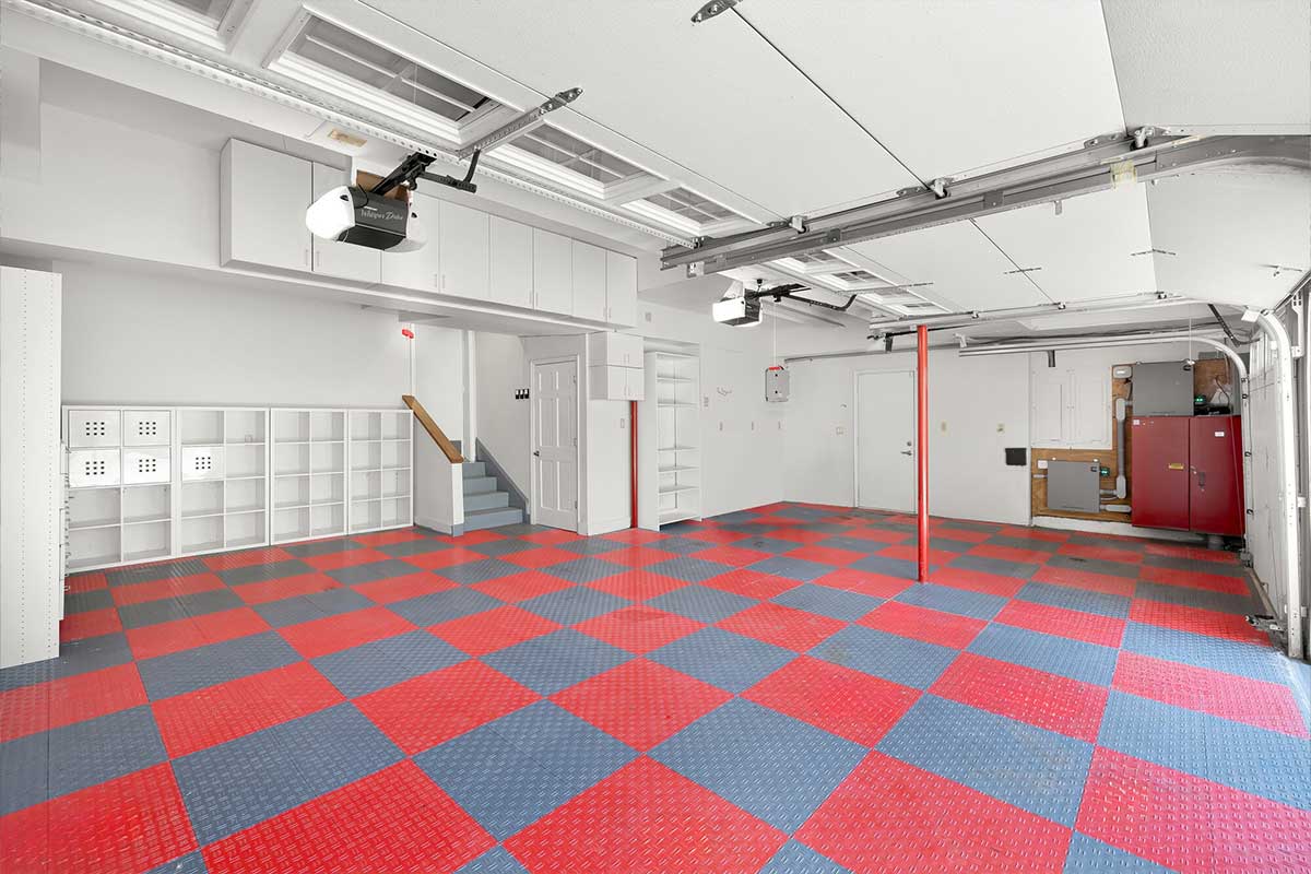 garage with cubbies and red and blue checkered floors
