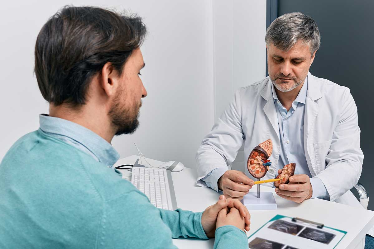male doctor talking to patient about kidneys