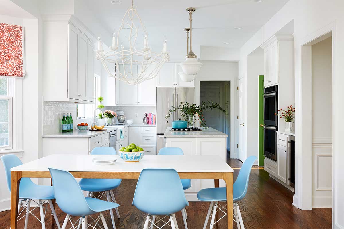 white kitchen with blue table chairs