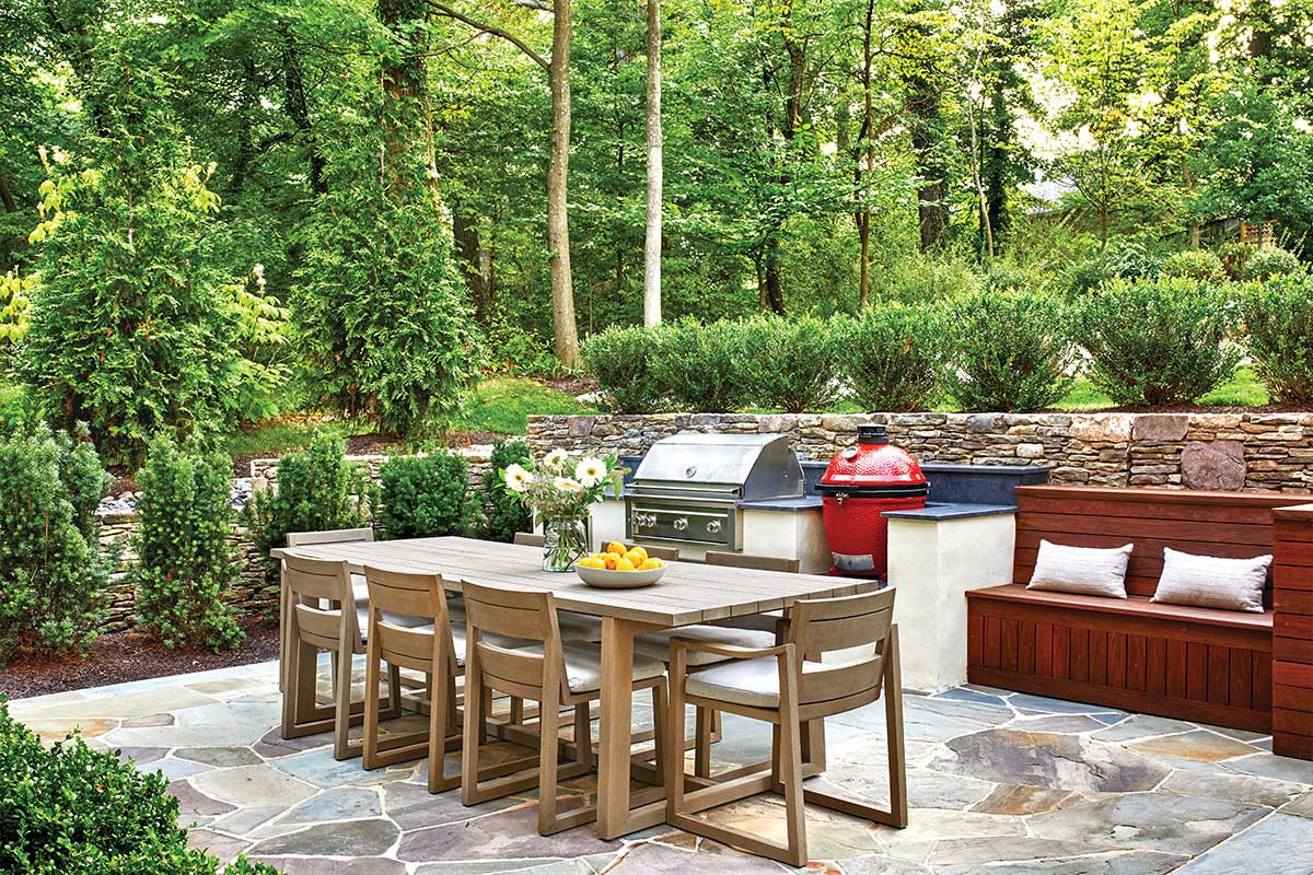 outdoor kitchen with grill and smoker